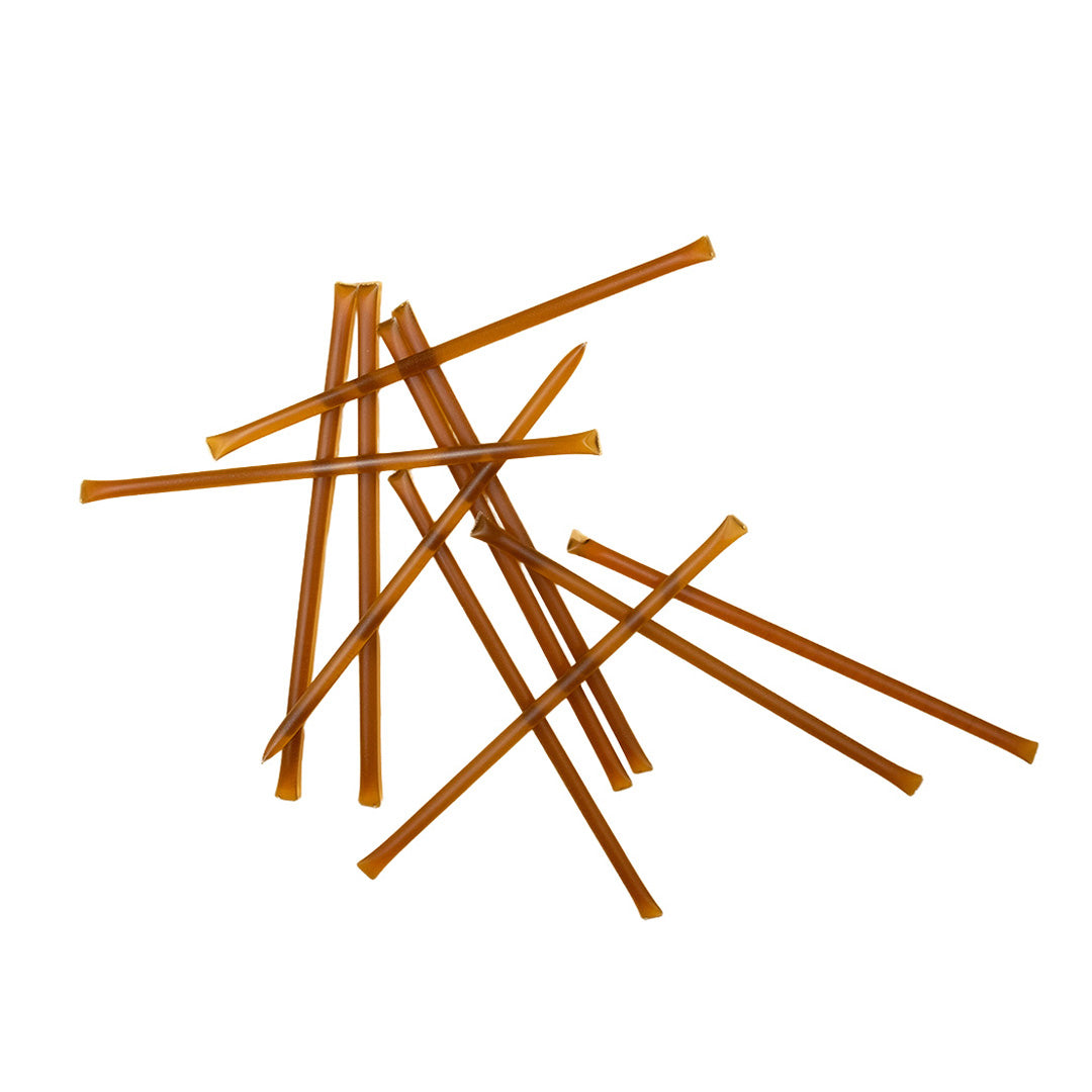 Brown honey sticks on a white background